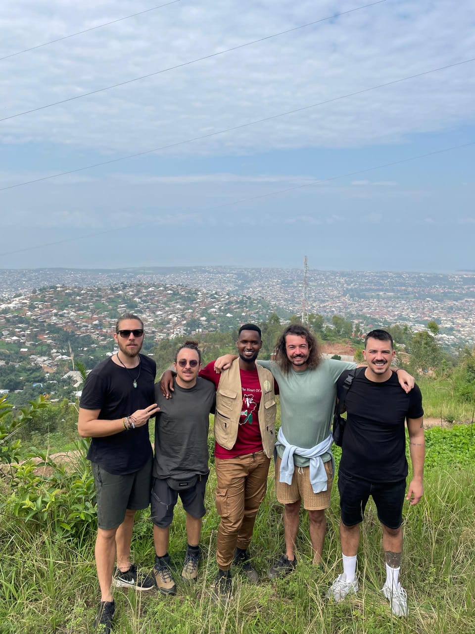 Travellers with their local guide overlooking Bujumbura