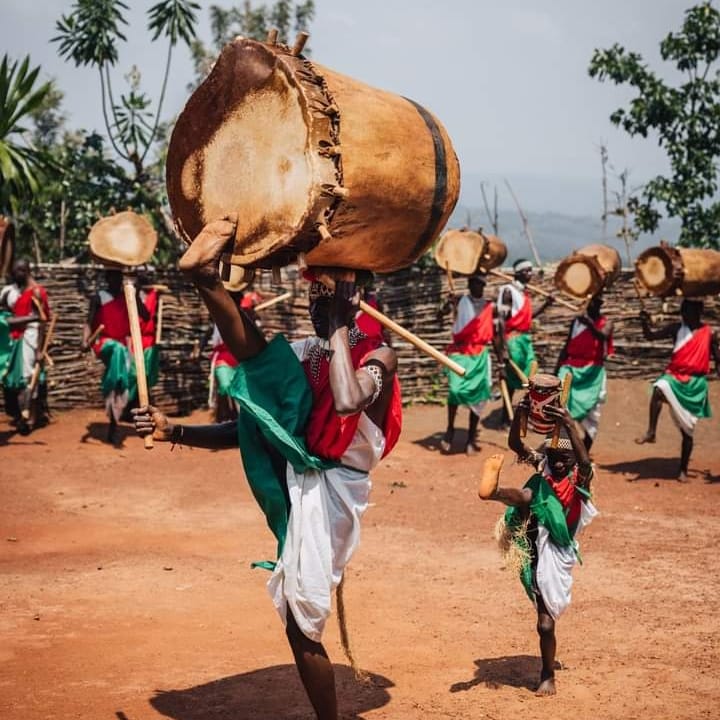 Royal drummers of Burundi carrying drums on their heads during a performance
