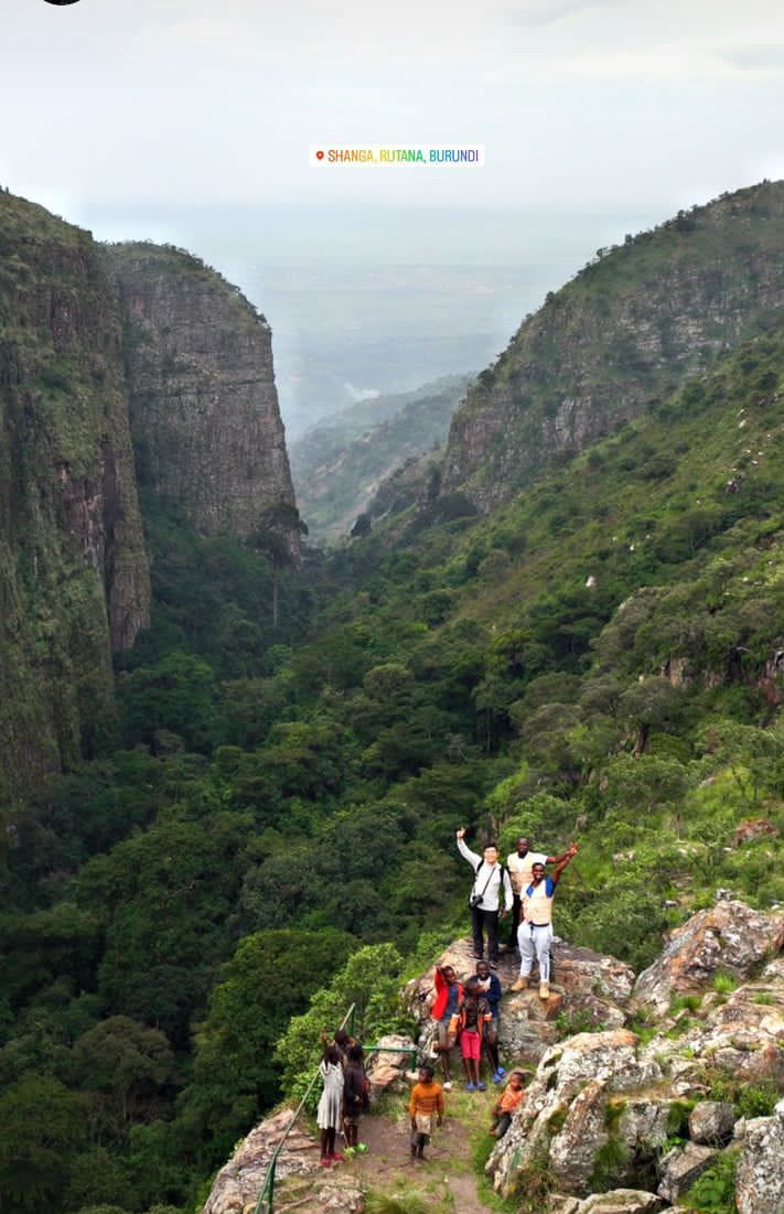 Mist rolling through a steep green gorge in the Burundi mountains