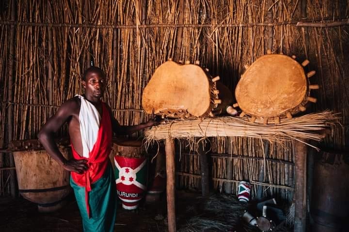 Keeper with the sacred drums inside the sanctuary