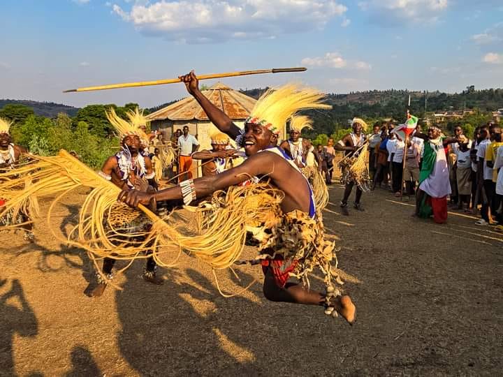 Traditional dancers performing in golden evening light